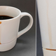 Image for article titled Clever Mug Catches Coffee Drips Before They Become Stains
